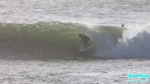 surfing a novelty sandbar on the california coastline with barreling waves